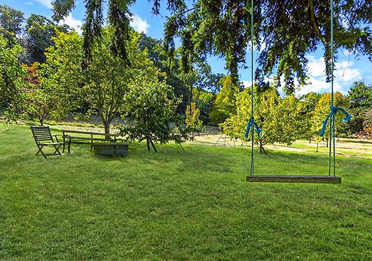 Coleridge Way long distance footpath is behind the orchard