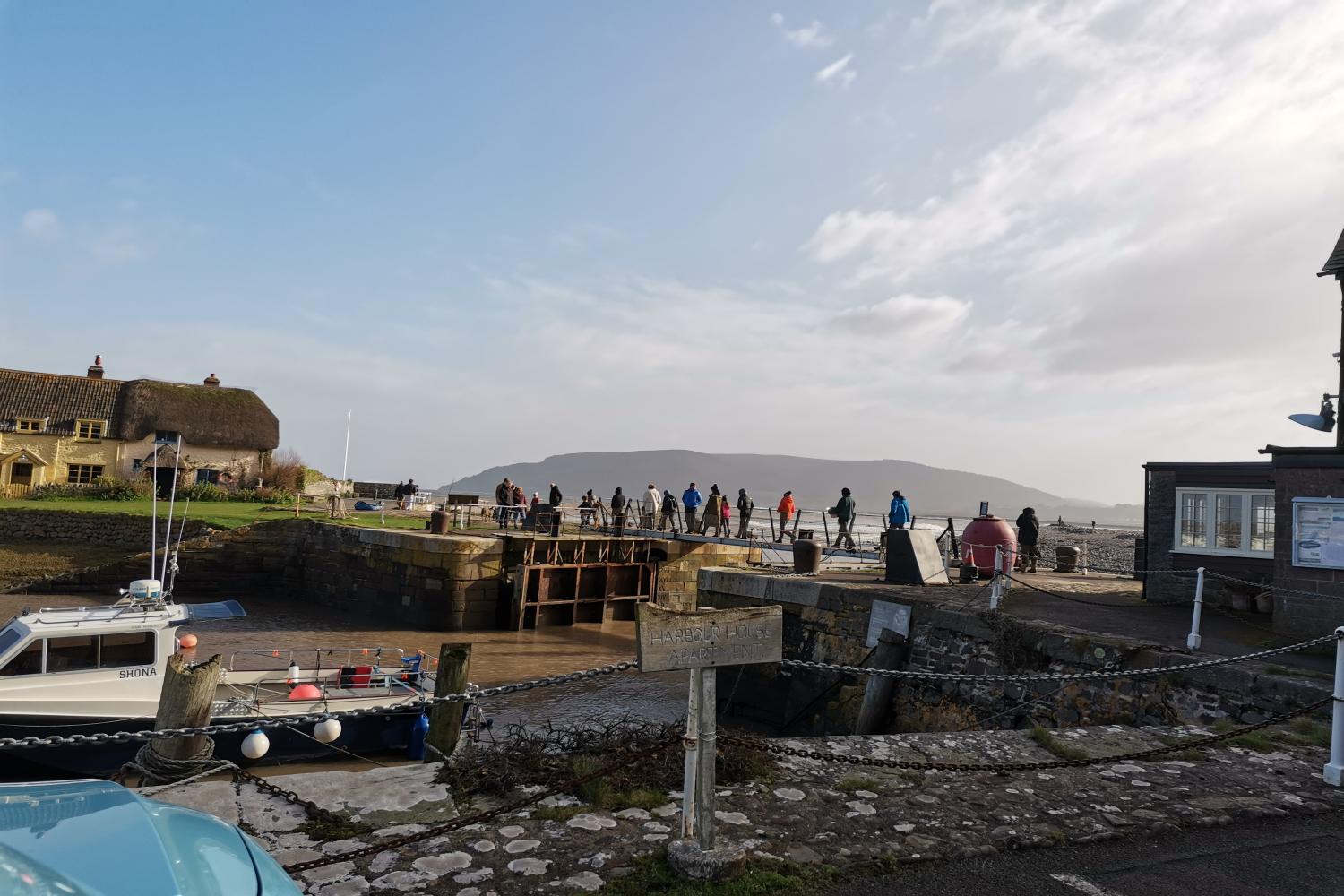 Walk the bridge from Porlock Weir Harbour onto Turkey Island