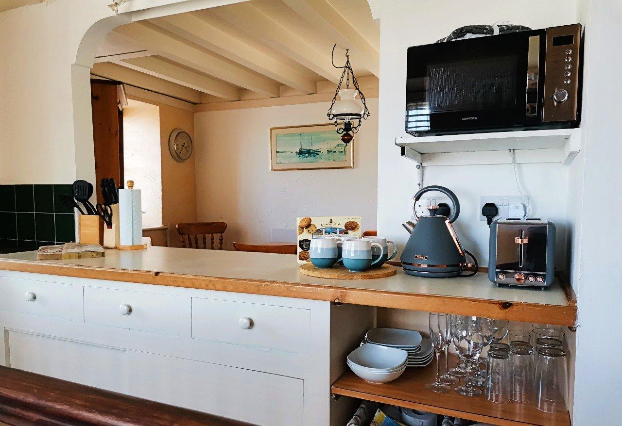 Well equipped galley style kitchen also with oven and hob (not in picture).