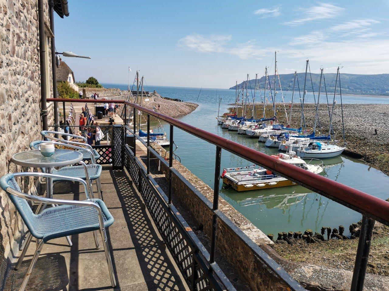 Drinks on your own private balcony overlooking Porlock Weir Harbour!