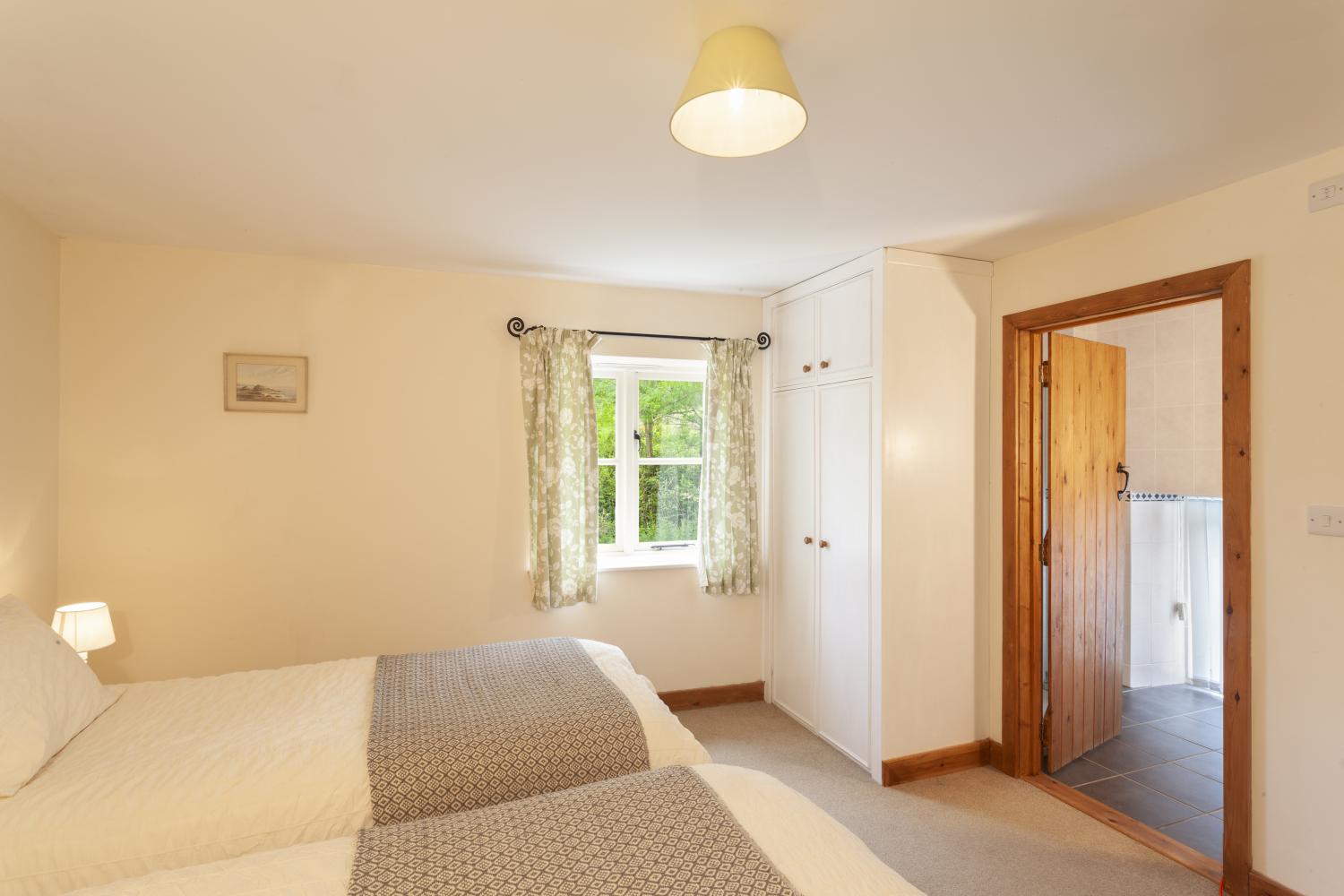 Twin bedrooms at The Mill House