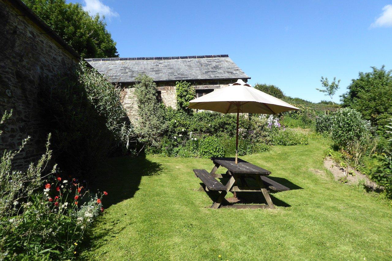 Private garden with picnic bench.