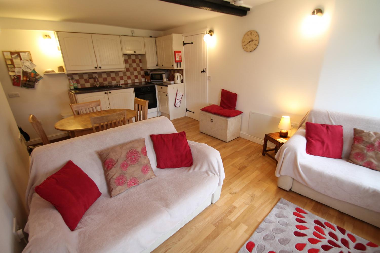 Open plan living-dining area at Porlock Hideaway