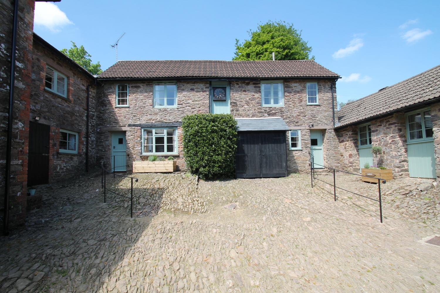 Grooms Cottage (right) and Stable Cottage