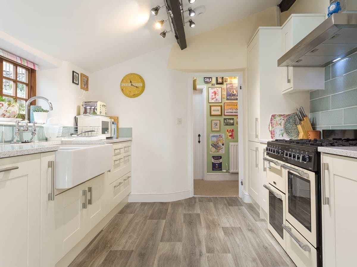 There's a dual fuel range cooker, larder fridge, double Butler sink and dishwasher in the kitchen.