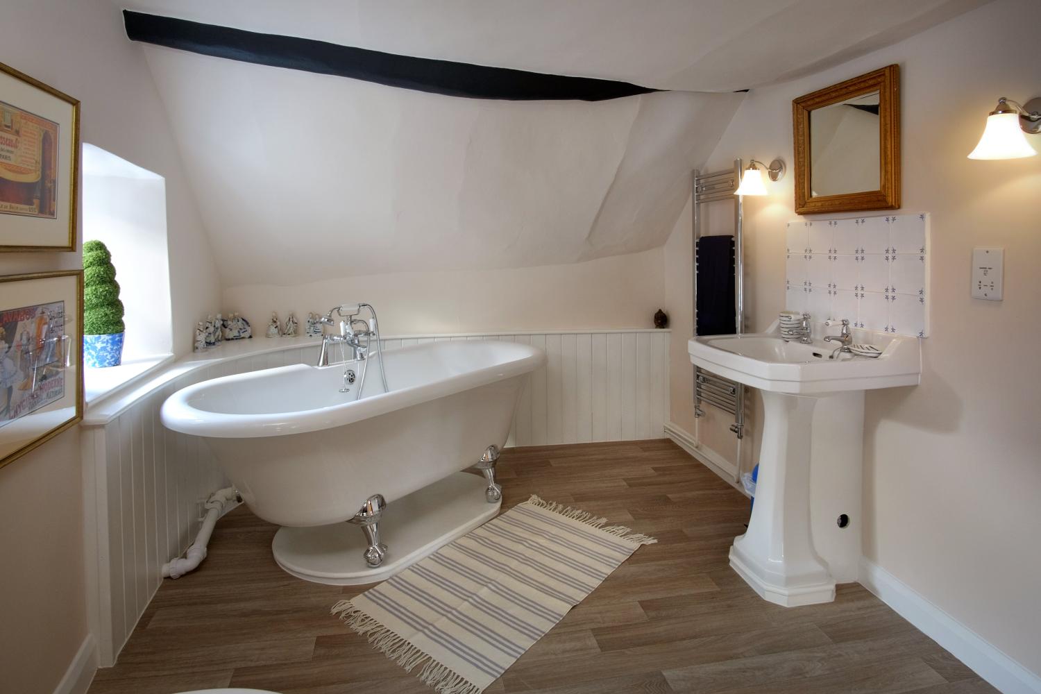 Marshmallow en-suite has a roll top bath (and low head height)