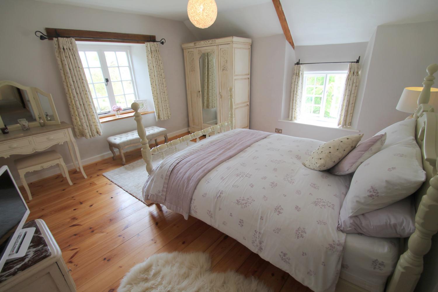 Large main bedroom with stunning views to the lake