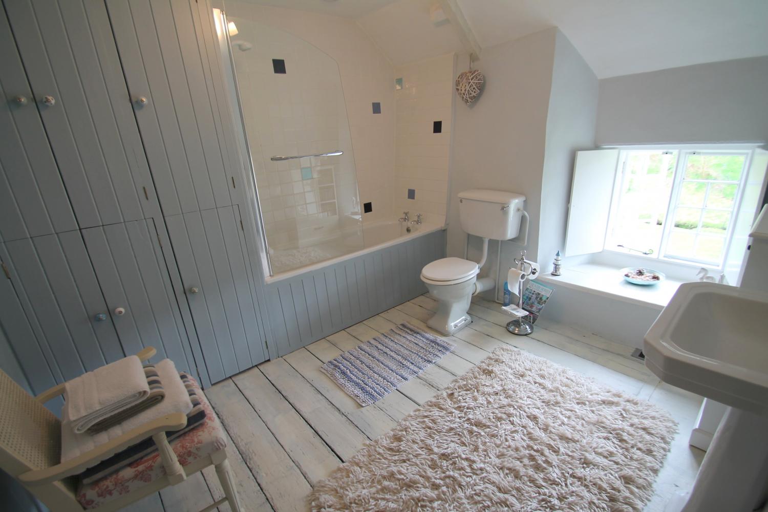 Large bathroom with bath, power shower and large sink