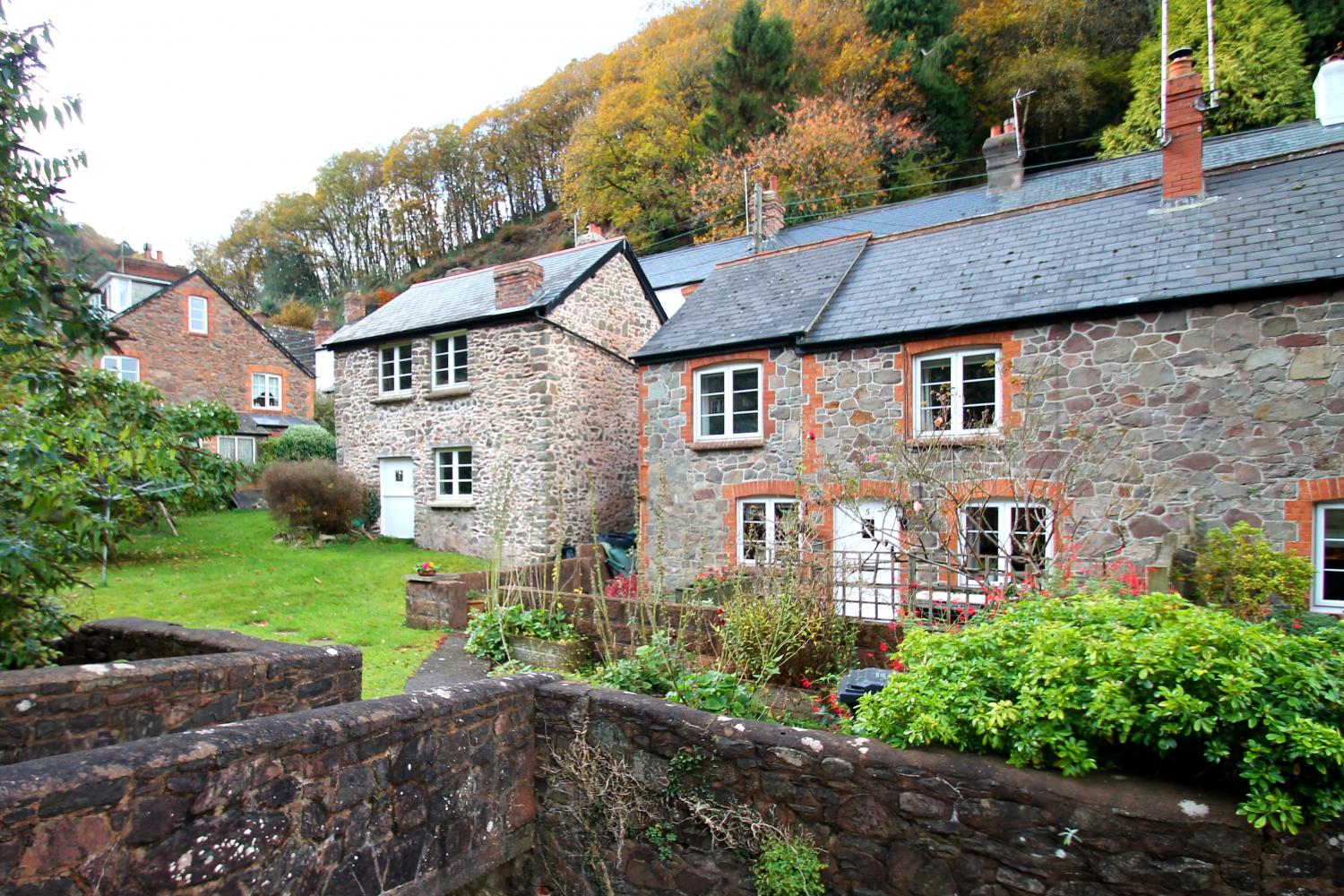 Magnolia Cottage is approached via its own bridge, over the Hawkcombe stream.