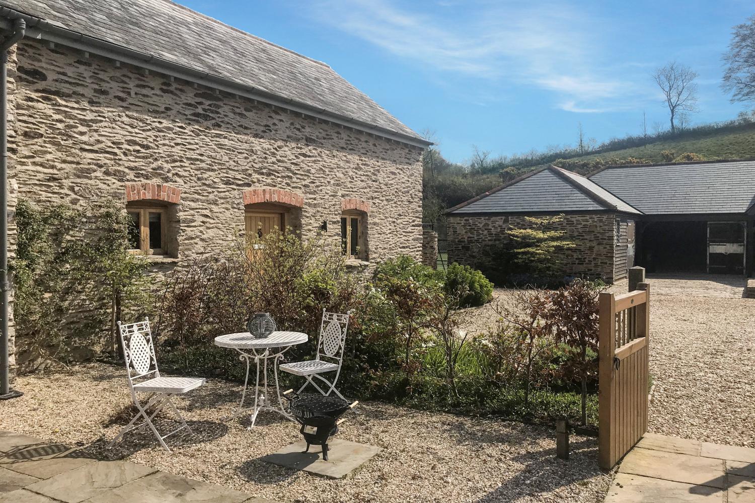 The Cowshed with patio table and chairs