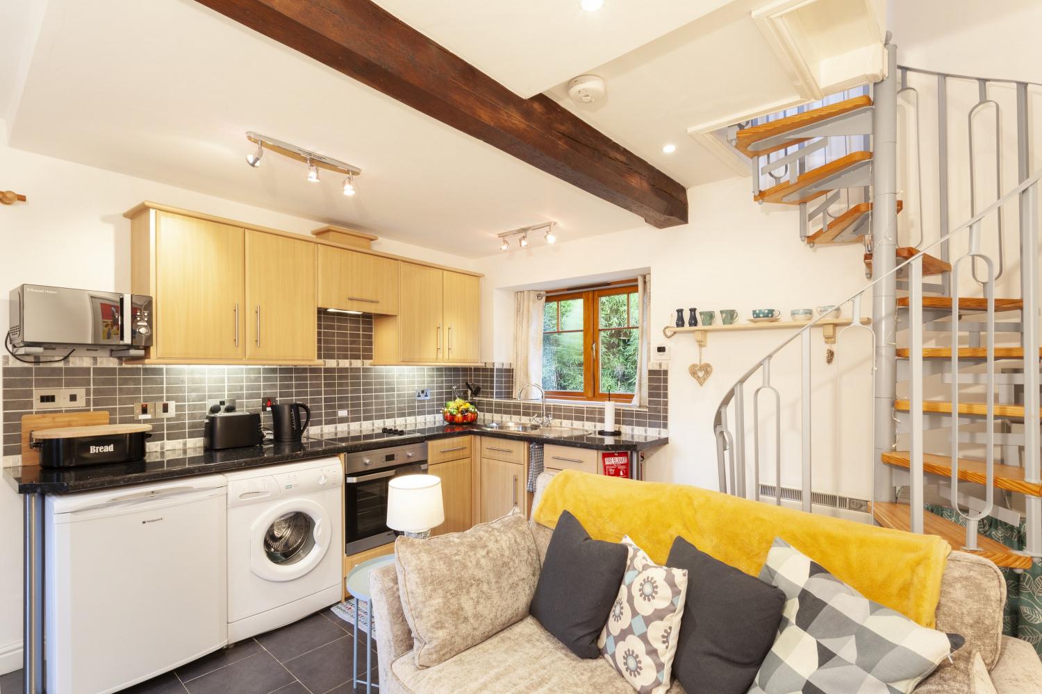 Living area and kitchen in Bamboo Cottage