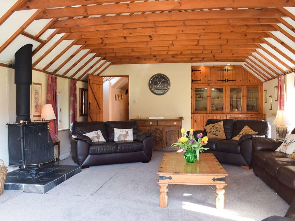 Spacious sitting room with wood burner & balcony