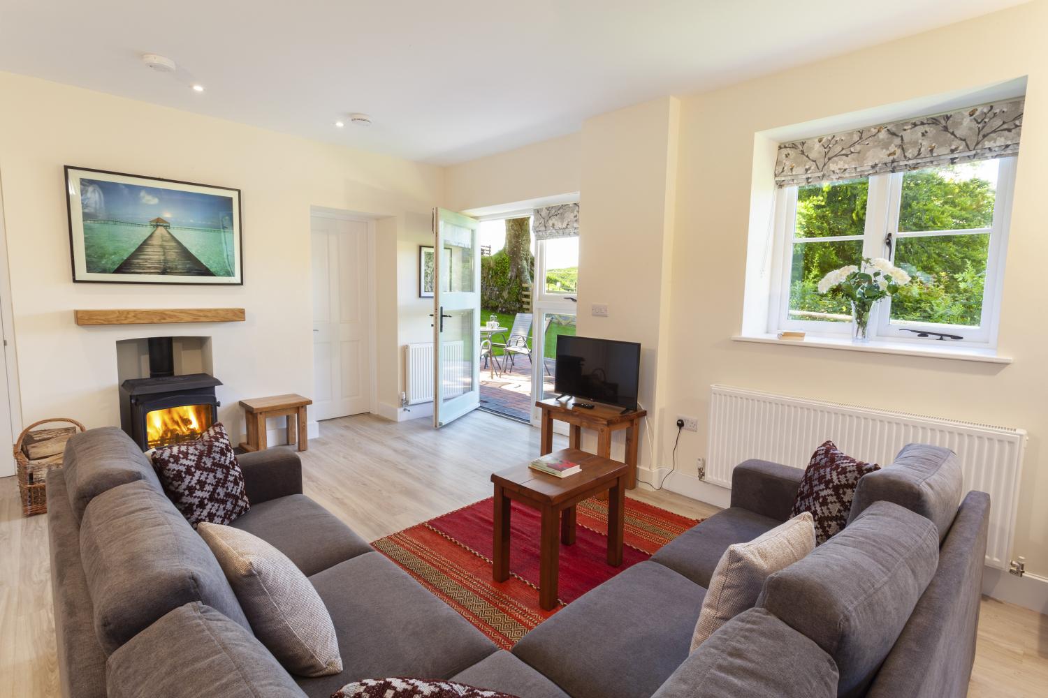 LIVING ROOM WITH WOOD BURNING STOVE