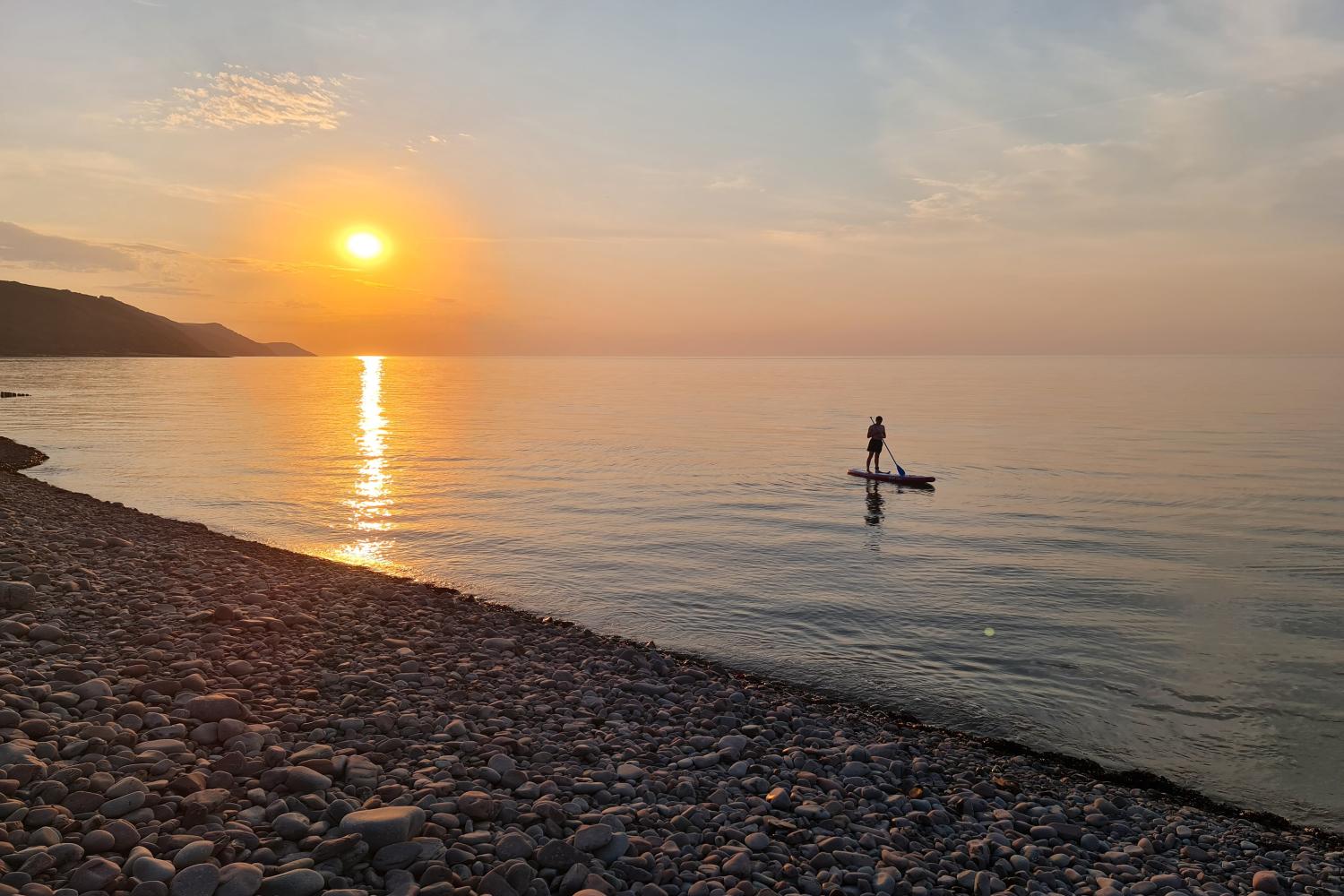 Paddleboarding into the sunset at Porlock Beach - August 2022