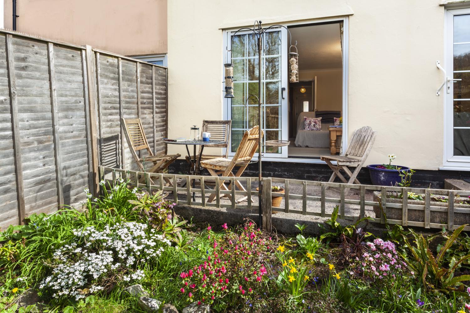 Patio doors from lounge with South facing seating area (more seating stored in shed)