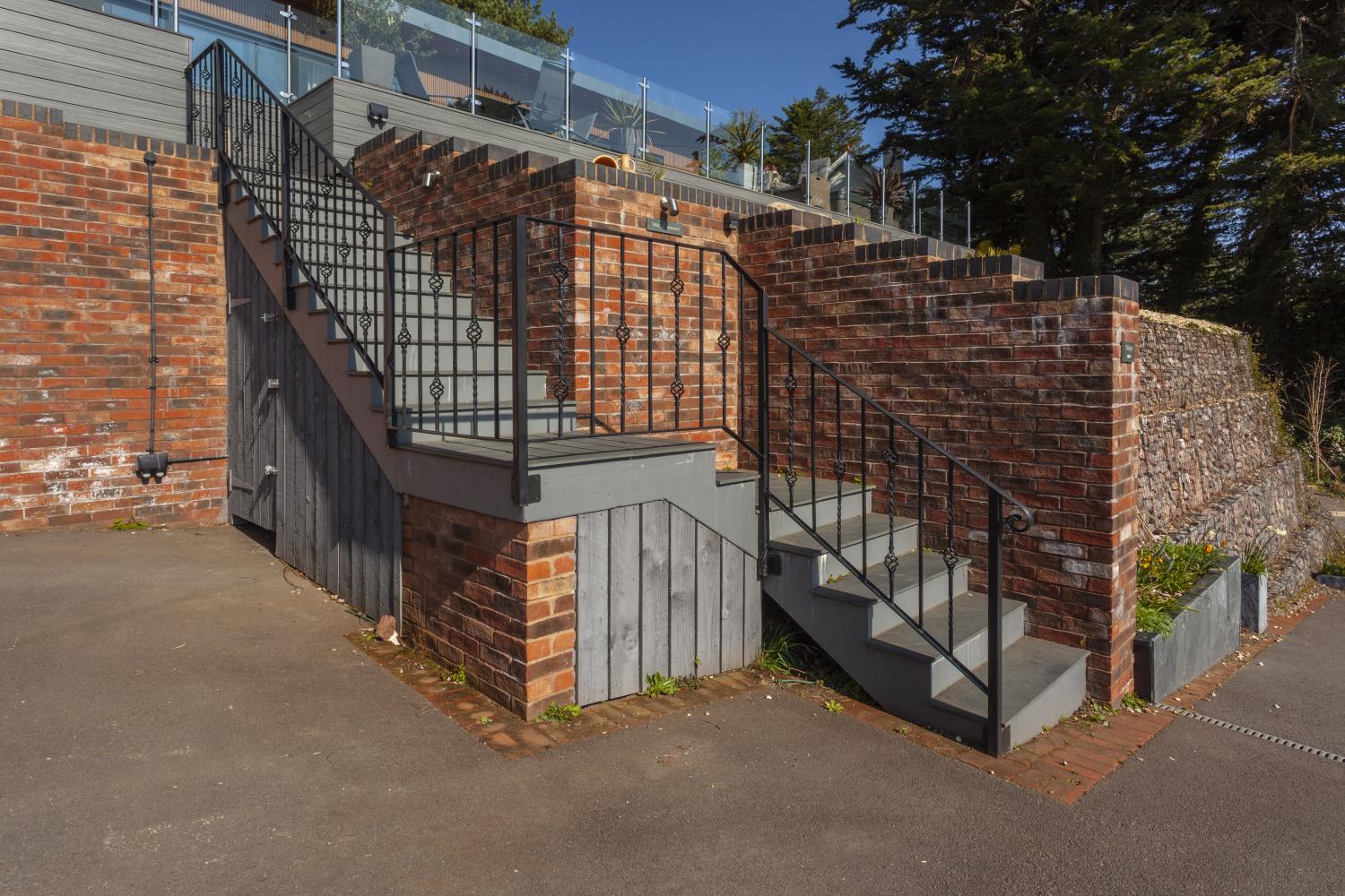 Steps from the parking area up to the property