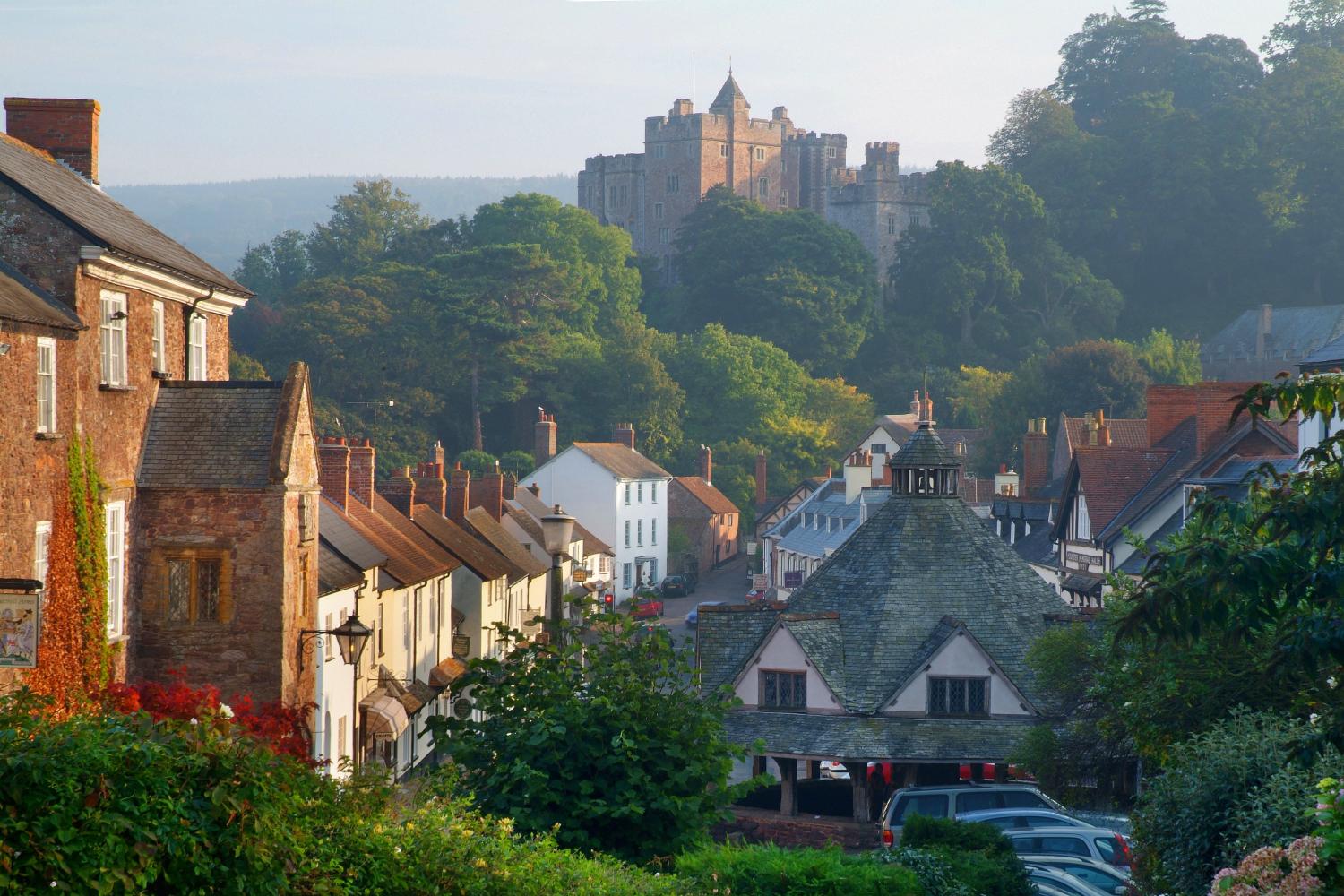 Dunster High St with Dunster Castle at the far end