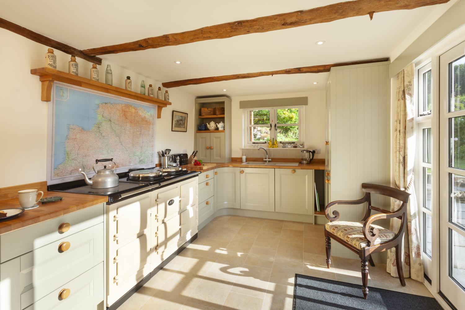 kitchen with electric aga and a exmoor map (and beyond) as your splashback!