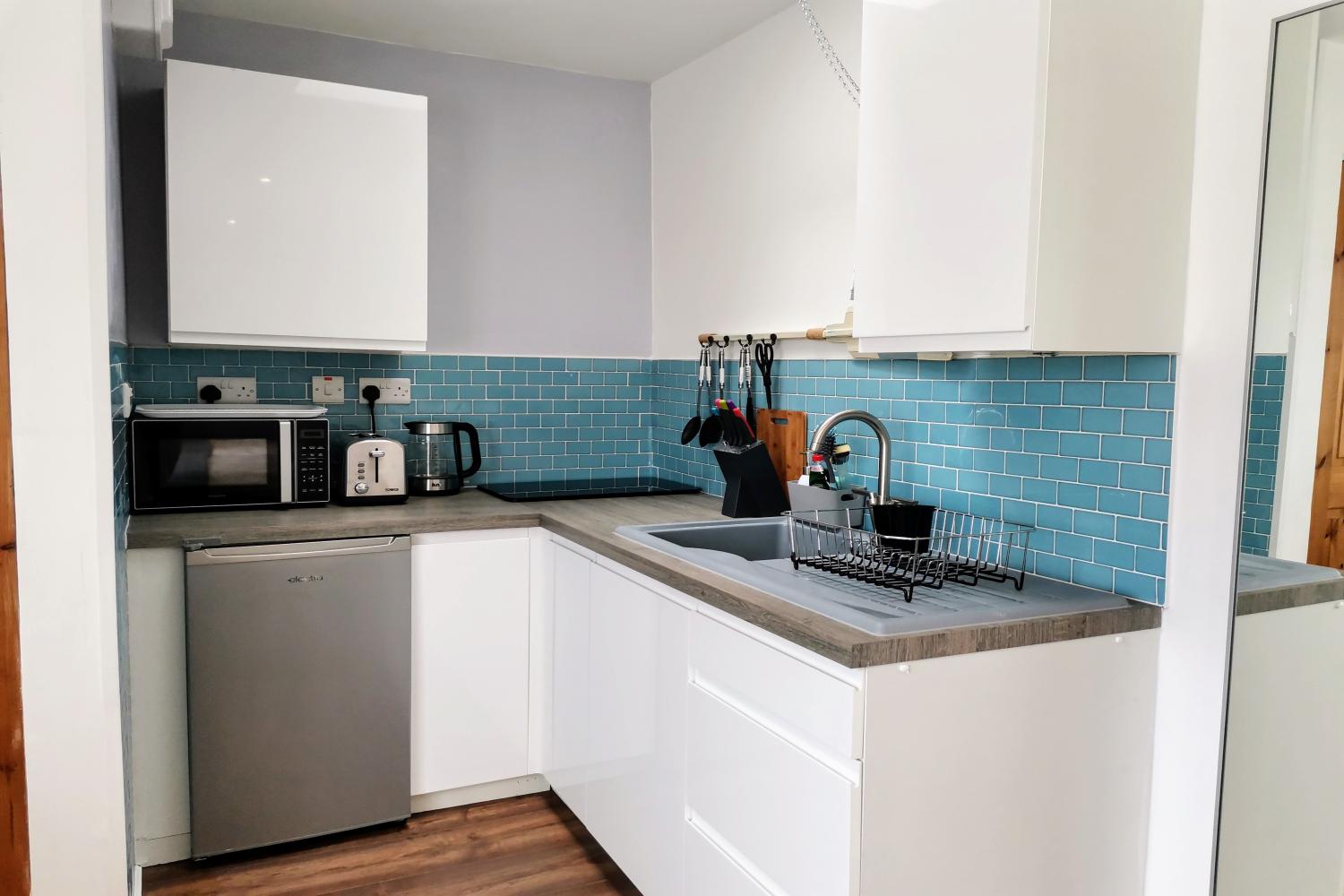 Well equipped kitchenette, 2 ring hob, kettle, toaster, microwave