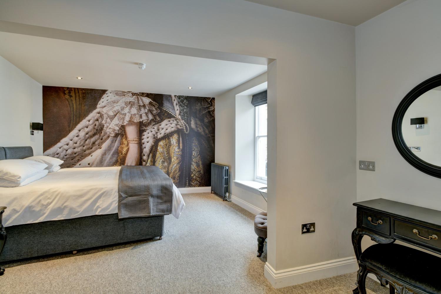 The Queens room. A super king bed or twin upon request when booking. En-suite bath & shower.