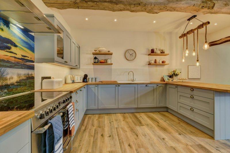 Kitchen with range cooker and breakfast bar