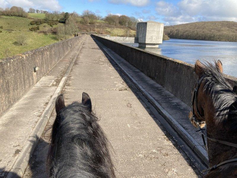 Riding over Wimbleball Lake dam