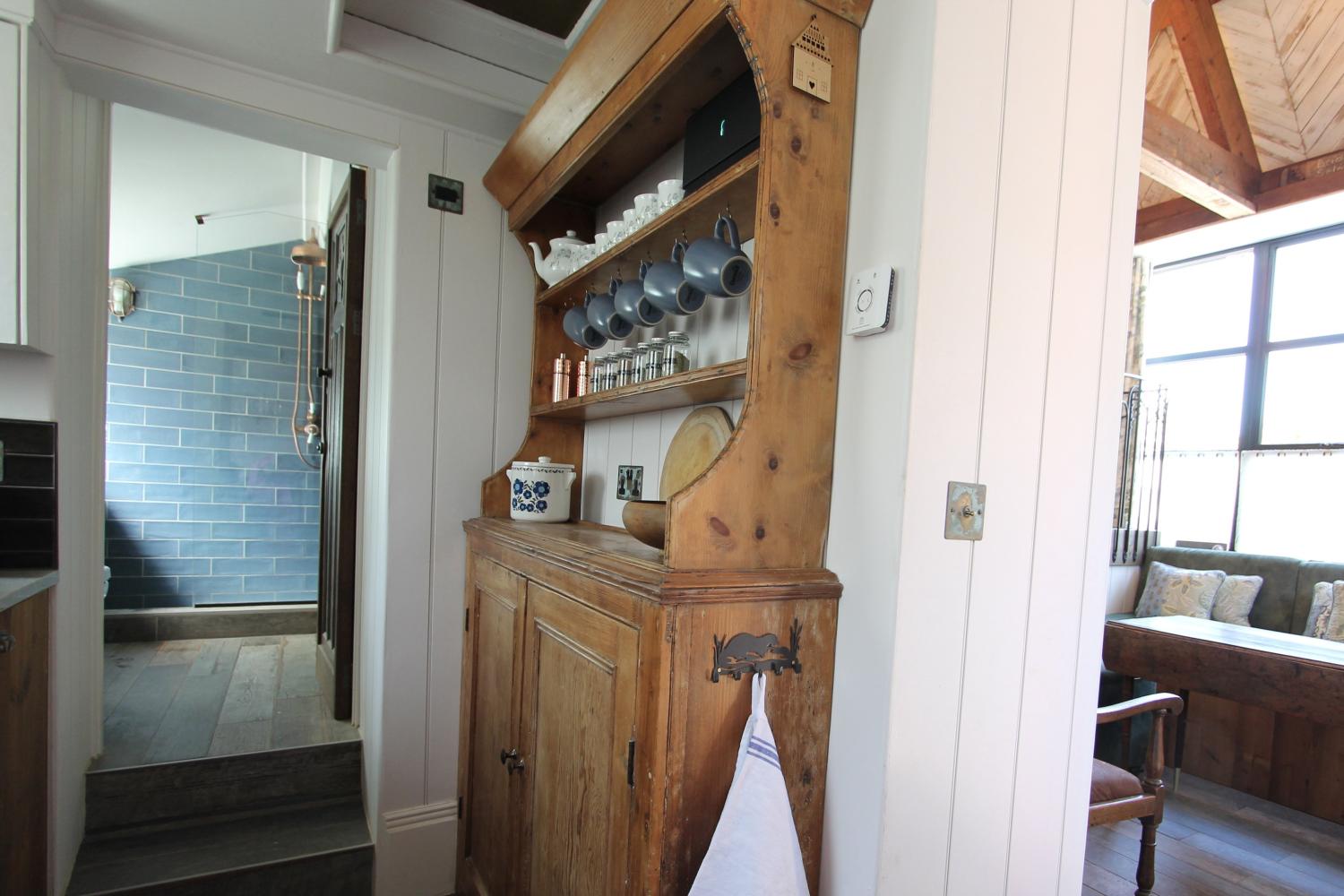The kitchen through to the living room and bathroom