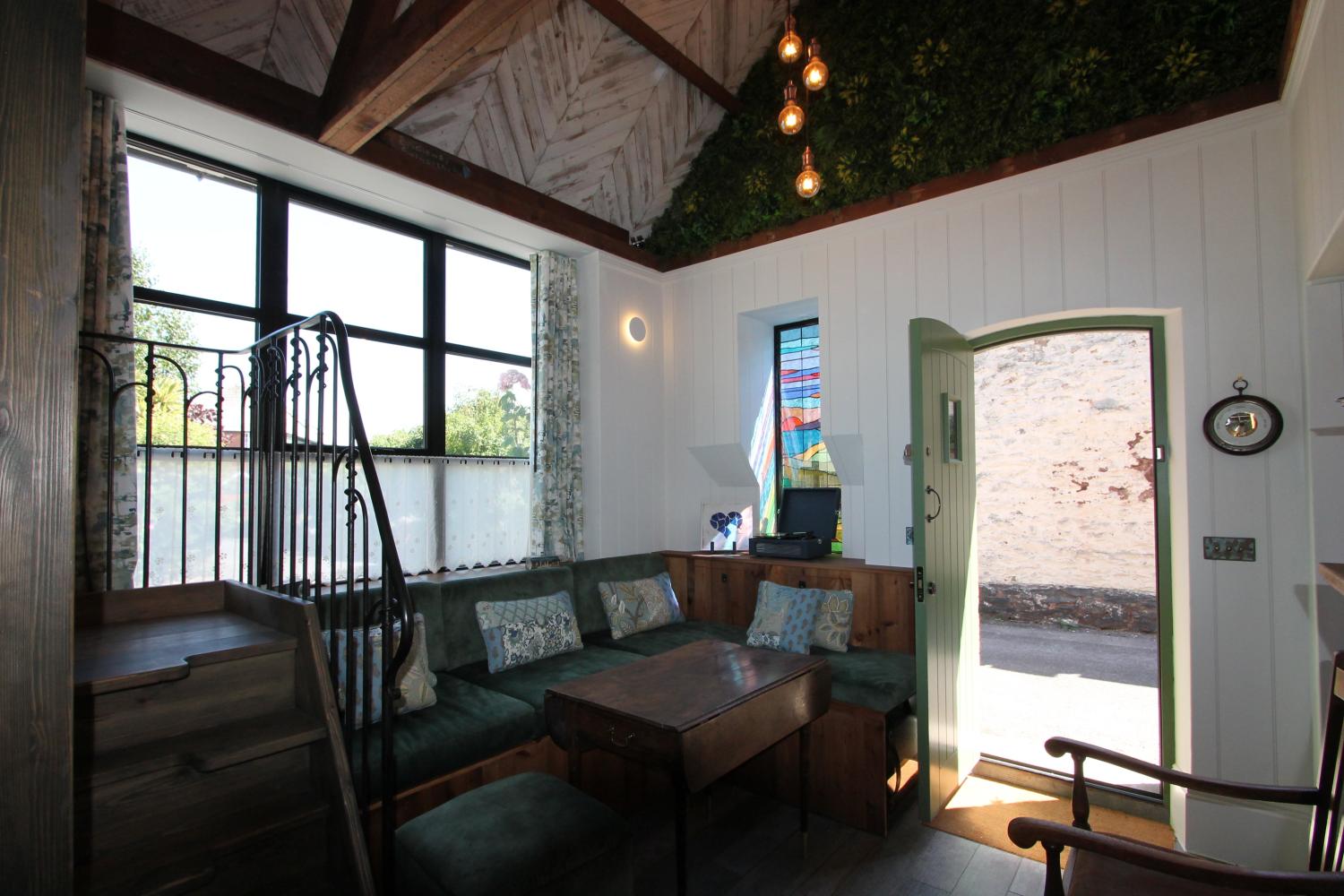 The front door open onto the private lane