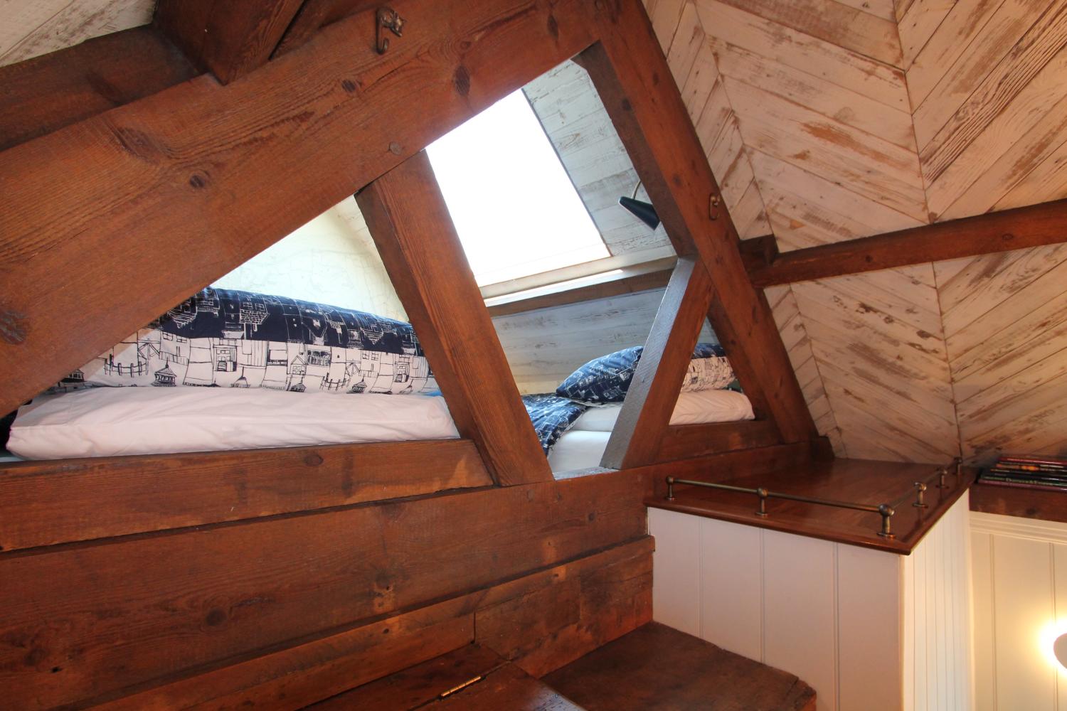 The mezzanine, luggage storage and step over the beams to the bed deck