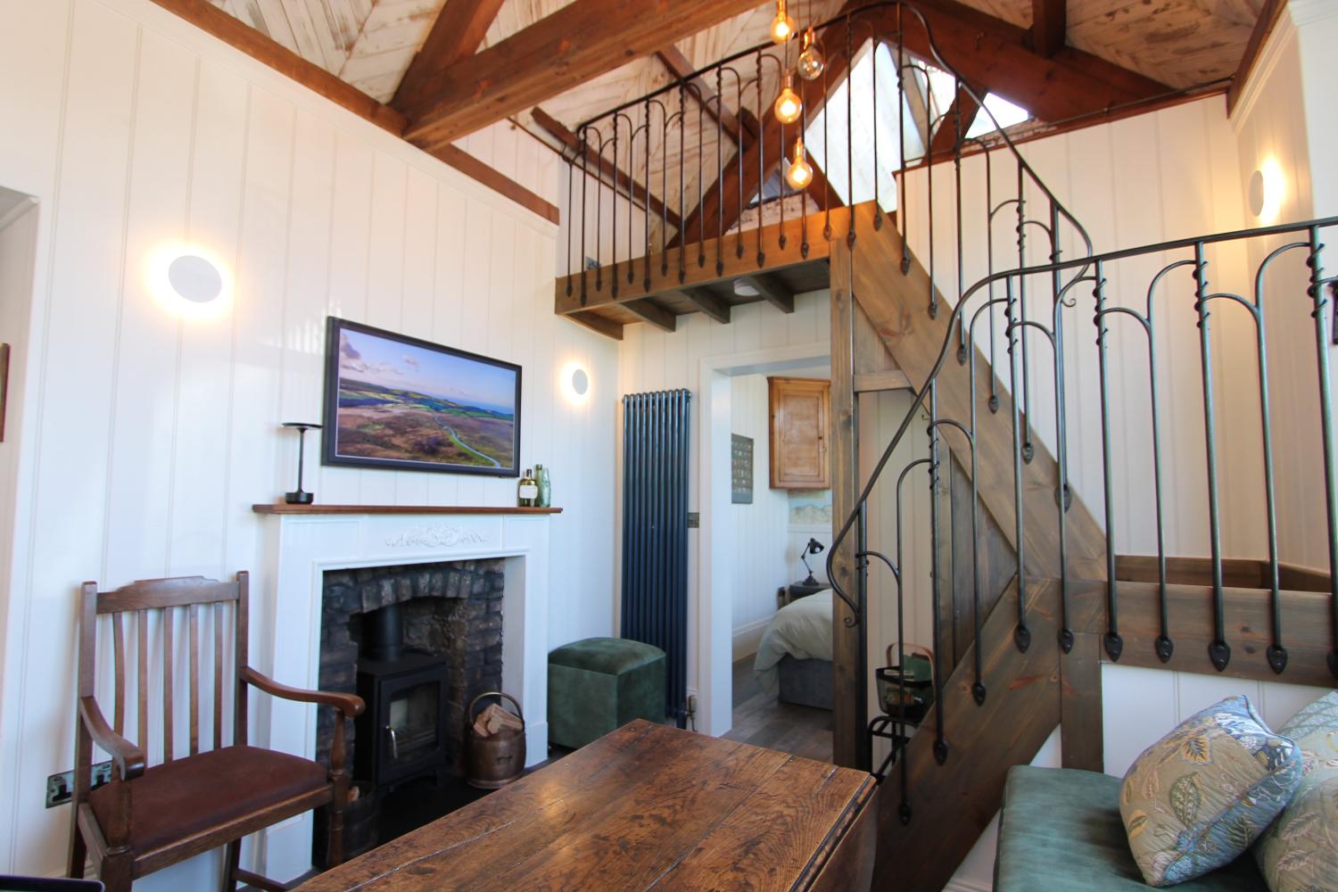 The living room looking towards the bedroom and mezzanine