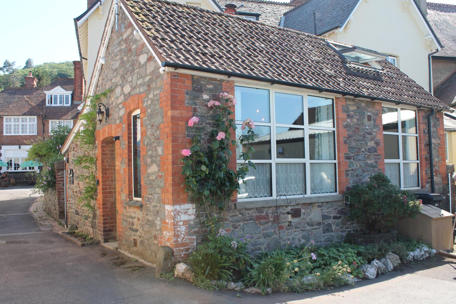 The outside of the house showing the living and bedroom windows